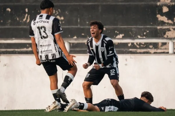 soccer players celebrating goal